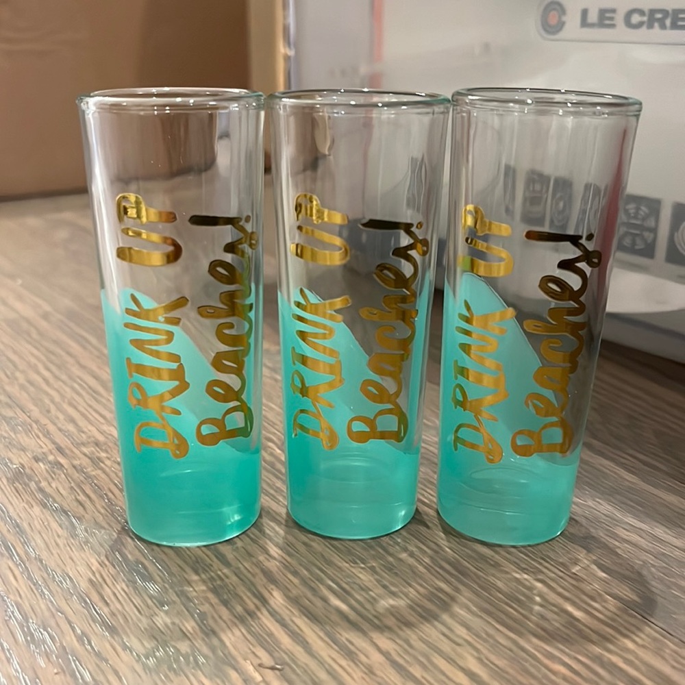 “Drink up beaches” shot glasses